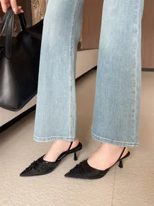 Elegant black pointed toe kitten heels with mesh embroidery and slingback strap