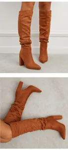 Brown faux suede slouchy knee-high boots with pointed toe and chunky block heel detail