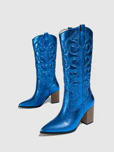 Side view showing the metallic blue finish and intricate embroidery on cowboy boots