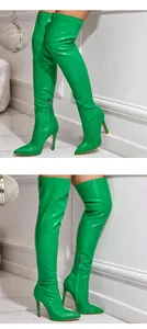Details of vibrant green crocodile-pattern over-the-knee boots with high stilettos