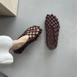 Elegant French style hollow woven flat sandals for women in breathable deep brown design