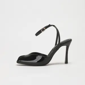 Elegant black patent leather peep toe high heels with slim ankle strap for formal events