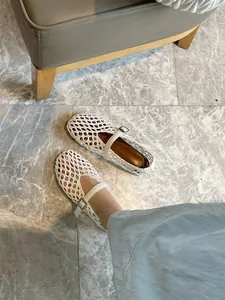 Close-up of white hand-woven Mary Jane flats featuring a breathable hollow-out design