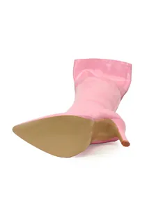 Detail view of pink thigh-high stiletto boot showing beige outsole and pointed toe