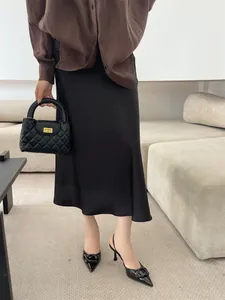 Elegant black pointed-toe slingback heels with a buckle detail for a chic look