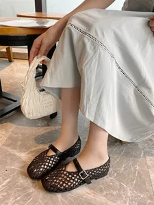 Detailed view of breathable black handmade woven mesh Mary Jane flats with ankle strap