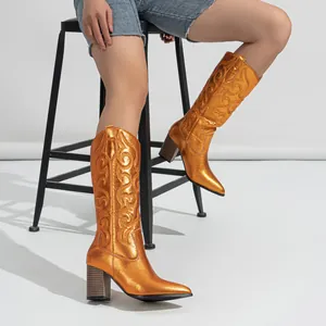 Metallic orange western cowboy boots with chunky heel and embroidered pattern for women