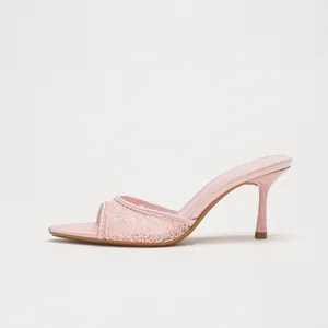 Elegant pink lace high heel mules featuring a pointed toe and slender stiletto heel