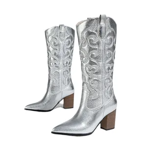 Elegant silver metallic Western cowboy boots with chunky high heels and pointed toes