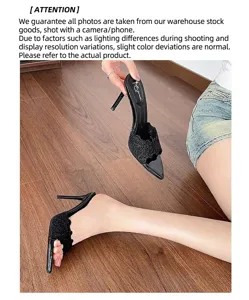 Detailed view of elegant black lace pointed-toe high heel slippers with thin stiletto heels