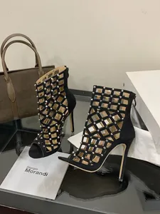 Elegant black studded hollow stiletto sandals featuring back zipper and peep-toe design.