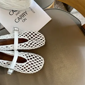 Detailed macro shot of white handmade woven breathable Mary Jane shoes with buckle strap