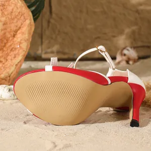 Detail of red and white color block high heel sandal with stiletto and anti-slip sole.