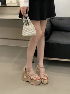 Women's wedge platform sandals featuring butterfly embellishments and floral print heels