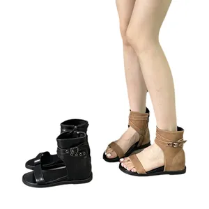 Stylish women's flat Roman sandals featuring breathable design and buckle ankle straps