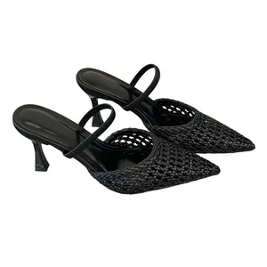 Detailed view of elegant black woven pointed-toe high heel mules for women's style