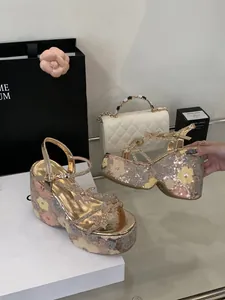 Detailed view of silver sequin platform sandals with exquisite rhinestone butterfly accents.