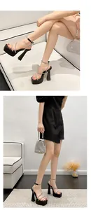 Side view of model wearing black chunky high heel platform sandals with rhinestone straps