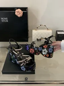 Chunky platform sandals with sequin flower patterns and rhinestone butterflies