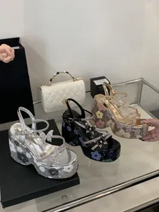 High-fashion platform sandals with butterfly crystals and sequin floral patterns.