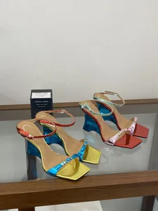 Stylish metallic color-blocked wedge sandals featuring unique heels and vibrant summer colors