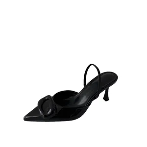 Sleek black pointed-toe stiletto heels with a decorative buckle and slingback strap.