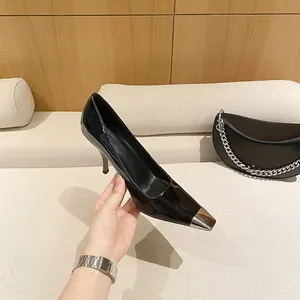 Elegant black pointed-toe stiletto pumps with sleek metal toe cap for a modern commuter look