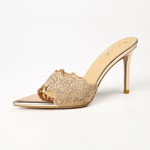 Elegant champagne gold lace pointed toe high heel mules featuring a slim stiletto heel