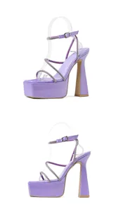 Detail view of purple platform sandals with rhinestone straps and high chunky heels