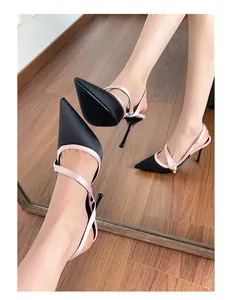Elegant black and pink satin pointed-toe stiletto high heel sandals shown from a side angle