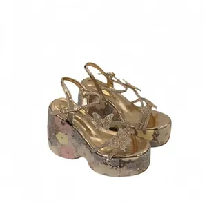 Women's platform sandals with glitter floral sole and butterfly peep-toe straps