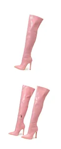 Detailed view of pink crocodile pattern over-the-knee boots with high stiletto heels