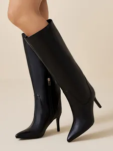 Elegant black pointed-toe stiletto knee-high boots with side zipper detail.