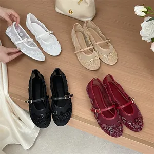 Close-up detail shot showing four elegant colors of embroidered mesh ballet flats shoes.