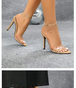 Side view of nude high heel sandals with transparent straps and slim stiletto heel