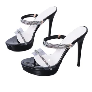 Elegant black rhinestone stiletto sandals featuring high platform and transparent straps.