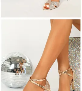 Close-up of shiny champagne gold high-heeled sandals with elegant cross straps