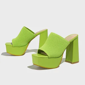 Vibrant lime green platform sandals featuring ribbed knit upper and chunky high block heels