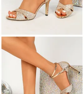 Detailed view of champagne gold glitter high heel sandals with crossover straps.