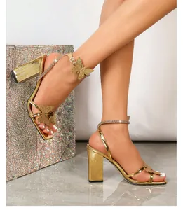 Elegant gold butterfly block heel sandals with rhinestone straps and square toe