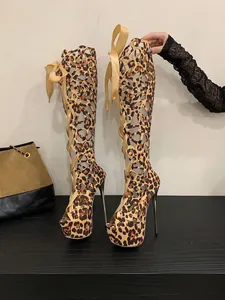 Close-up view of leopard print peep-toe cutout boots featuring ribbon lace-up design