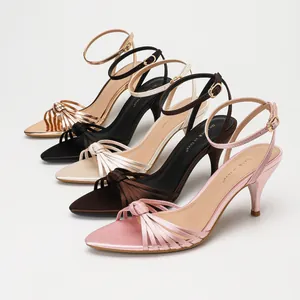 Elegant satin sandals with cross-strap knots and kitten heels available in multiple colors.