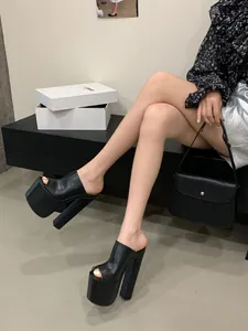 Stylish black platform peep-toe mules featuring chunky high heels and street style vibe.