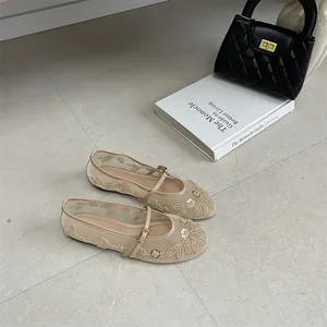 Beige mesh flat shoes with elegant floral embroidery and adjustable Mary Jane strap