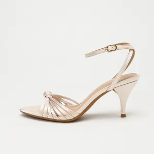 Elegant champagne satin sandals featuring knotted multi-straps and a slim stiletto heel.
