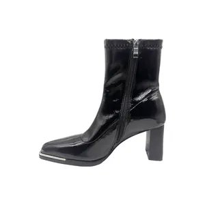 Elegant black patent leather ankle boots featuring square toe and chunky block heel