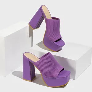 Vibrant purple knit platform mules featuring a square toe and chunky block high heels