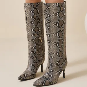 Chic snakeskin knee-high boots with pointed toe and slender stiletto heels for fashionable women