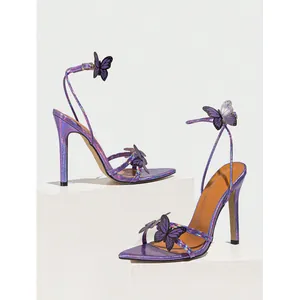 Detailed view of elegant purple holographic stiletto sandals with 3D butterfly decor