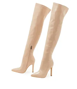 Elegant nude patent leather pointed-toe thigh-high boots featuring slim high stiletto heels